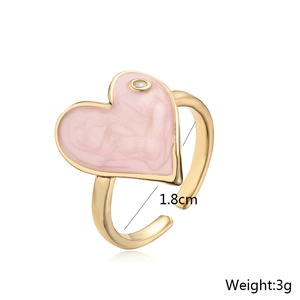 Detail shot of pink enamel heart ring with size 1.8cm and weight 3g measurements