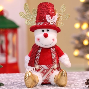 Detail of sequined red Christmas doll with golden antlers and plush fabric texture
