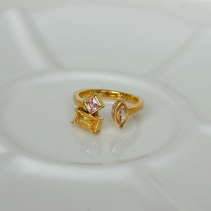 Detail of 18k gold plated open ring featuring colorful square and teardrop zircons