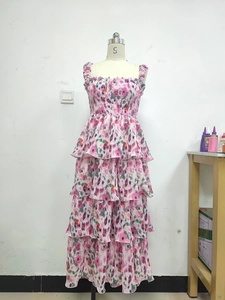 Detail of pink floral tiered maxi dress with ruched bodice and layered ruffle skirt