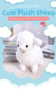 Detail of soft white plush sheep toy with golden bell and fleece texture detail