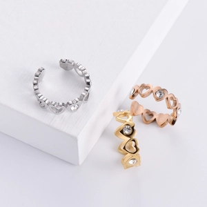 Macro detail of heart-shaped open ring featuring sparkling cubic zirconia stones