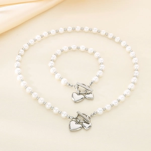 Elegant pearl necklace and bracelet set with silver heart charms and OT toggle clasp