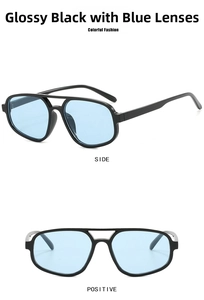 Close-up of stylish double bridge sunglasses with black frames and light blue lenses