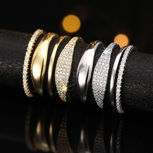 Set of four minimalist stackable rings with cubic zirconia in gold and silver finish