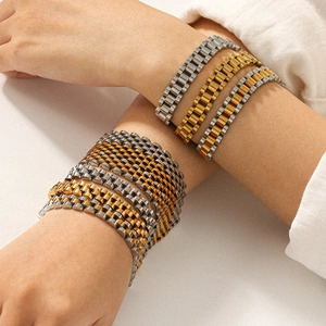 Detailed shot of titanium steel watch band bracelets in gold, silver, and two-tone finishes