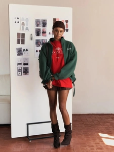 Detail of dark green zipper jacket and red logo t-shirt in cotton for trendy summer outfit