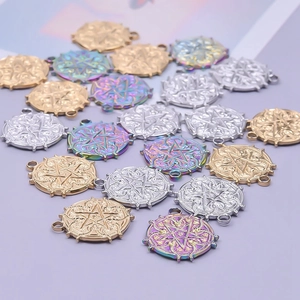 Detailed macro view of 18k gold and silver pentagram star charms for DIY jewelry making