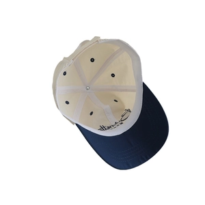 Quick-dry kids baseball cap in beige and navy patchwork with inner embroidery detail
