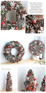 Detailed view of Christmas wreath featuring natural pine cones and red berries with snow