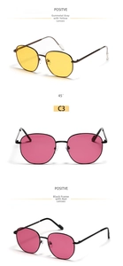 Detailed view of retro hexagonal metal sunglasses with yellow and rose red lenses