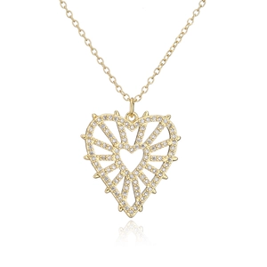 Detail of 18K gold plated hollow heart pendant with radiant sunburst and zircon stones