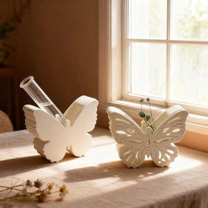Detailed view of hollow butterfly storage box and resin vase mold set in white