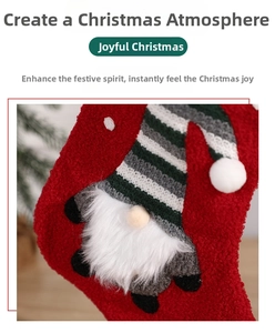 Detail of red plush Christmas stocking featuring a 3D gnome with a striped knitted hat