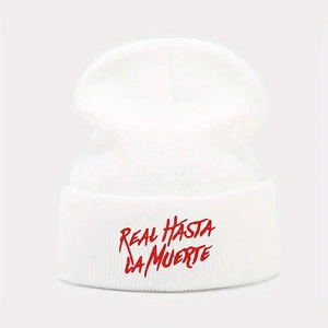 White knit beanie featuring red Real Hasta La Muerte embroidery in a classic cuffed style