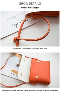 Detail of orange mini leather crossbody bag showing dual magnetic buckles and tied strap