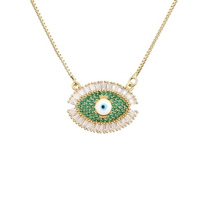 Gold evil eye necklace with green and white zircons on a delicate chain jewelry