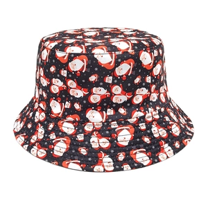 Detailed pattern of cartoon Santa Claus and snowflakes on a black reversible bucket hat