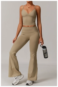 Detail view of yoga set featuring V-neck strap top and high-waisted flared leggings