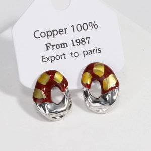 Detailed macro view of French vintage irregular oval earrings crafted in 100% copper