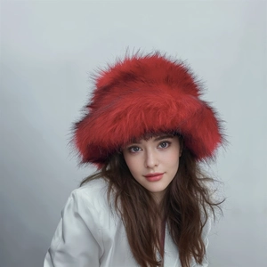 Detail of fluffy red faux fur winter hat with a punk-inspired long plush texture