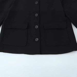 Women black short wool jacket featuring stand collar and large flap pockets detail
