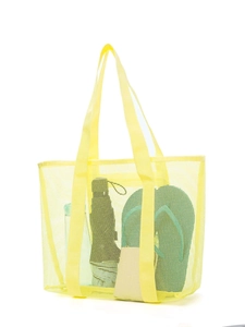 Detail of yellow mesh beach bag showing large capacity with umbrella and water bottle