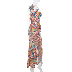 Detail view of colorful geometric print maxi dress with a halter neck and side slit