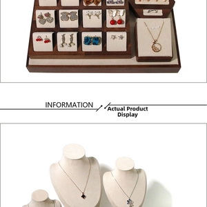 Macro view of walnut wood and beige velvet display stands for earrings and necklaces