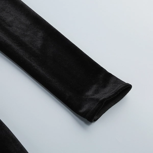 Close-up of velvet sleeve cuff showing high-quality stitching on elegant off-shoulder dress