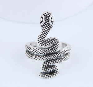 Detail of vintage snake ring showing intricate scale texture and antique silver finish
