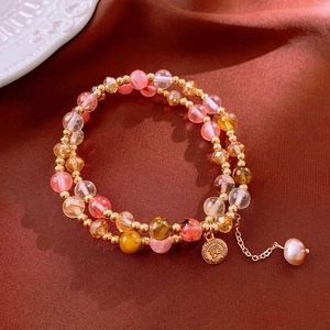 Elegant white crystal beaded double-layer bracelet with a gold coin pendant and pearls