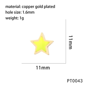 Macro shot of an 11mm fluorescent yellow star pendant with 1.6mm hole in gold plated copper