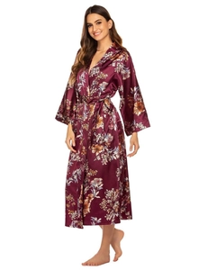 Detail of burgundy satin floral robe featuring long sleeves and waist tie closure