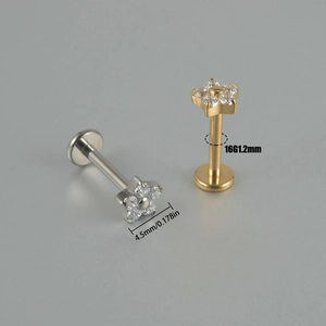 Detailed view of G23 titanium labret studs with flower zirconia and 16G 1.2mm size labels