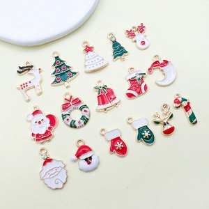 Flat lay of 16 colorful Christmas enamel alloy charms including Santa and reindeer