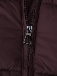 Close-up of a high-quality zipper and quilted texture on a maroon padded parka coat