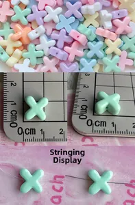 Detailed macro view of 1cm macaron color star beads with holes for DIY craft jewelry