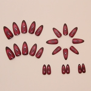 Gothic Halloween press-on nails featuring red black gradient and spider web designs