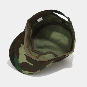 Flat top camouflage army hat showing interior stitching, lining, and care label
