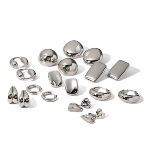 Polished silver stainless steel earring set with geometric shapes and heart pendants