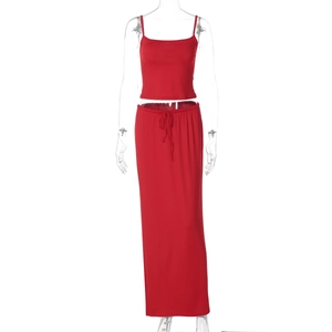 Detail of red two-piece set featuring thin strap crop top and drawstring waist long skirt