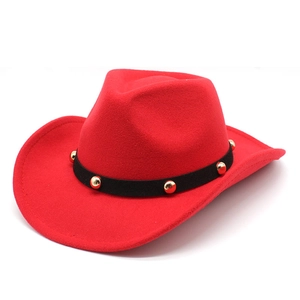 Detail of red wool felt cowboy hat with black band and gold studded metal rivets