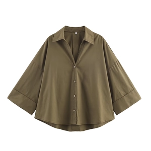 Deep olive green oversized poplin shirt featuring wide sleeves and a relaxed silhouette