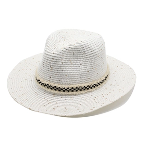 White straw fedora hat with gold sequins and black checkerboard frayed ribbon trim