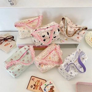 Detailed view of canvas tote bags featuring lace trim, quilted fabric, and cute cartoon patterns