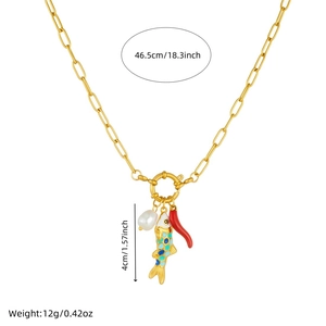 Golden pearl necklace with colorful fish and chili pepper pendants on white background