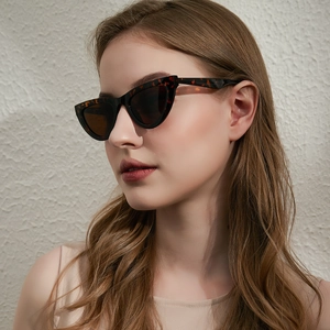Classic tortoise shell cat-eye sunglasses with dark brown lenses for a retro fashion look
