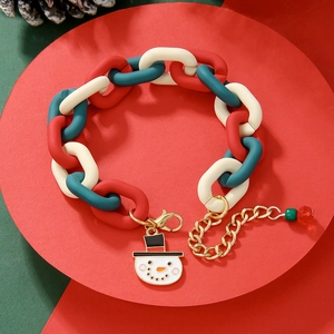 Detail view of Christmas charm bracelet with red green acrylic beads and snowman pendant