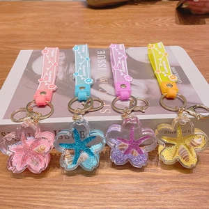 Floating liquid marine animal keychains with starfish charms in four vibrant colors